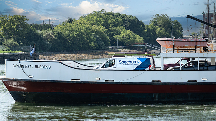 Ferry arrives at the Maine island carrying a Spectrum van