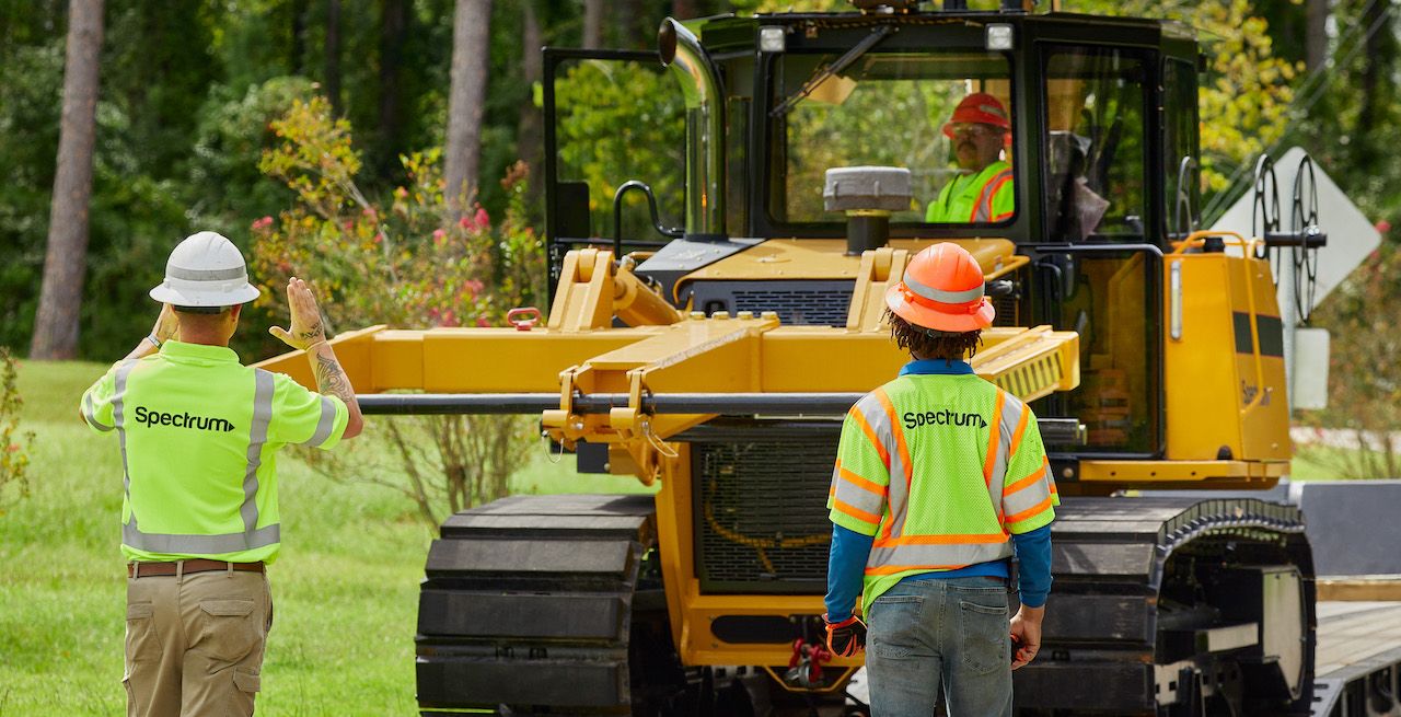 Spectrum technician crew working on a broadband expansion project